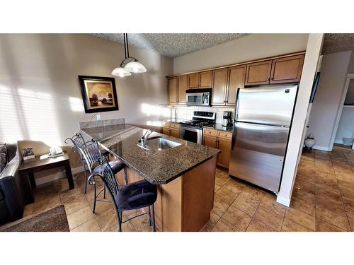 415 Q - 400 Bighorn Boulevard, Radium Hot Springs, BC - Indoor Photo Showing Kitchen With Stainless Steel Kitchen
