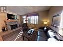 400 Bighorn Boulevard Unit# 415 Q, Radium Hot Springs, BC  - Indoor Photo Showing Living Room With Fireplace 