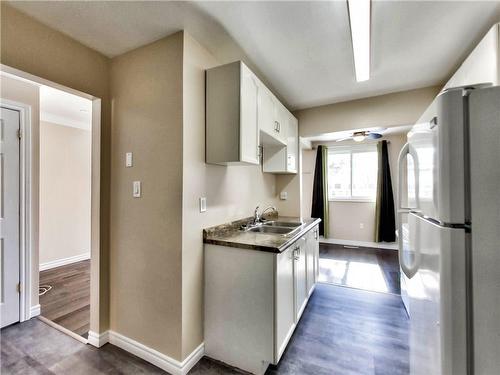 100 Quigley Road|Unit #141, Hamilton, ON - Indoor Photo Showing Kitchen With Double Sink