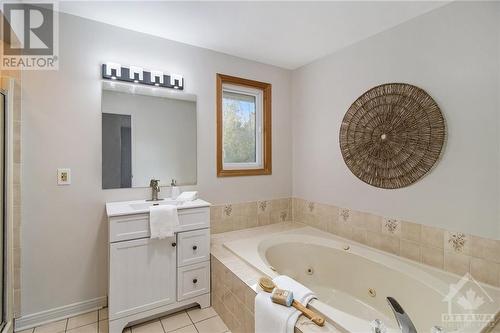 Ensuite with Whirlpool Tub - 134 Topaze Avenue, Ottawa, ON - Indoor Photo Showing Bathroom