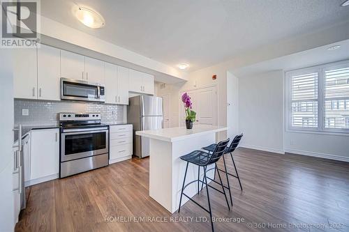 #35 -100 Long Branch Ave, Toronto, ON - Indoor Photo Showing Kitchen