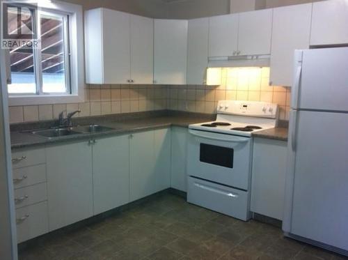 1800-1802 Mission Road, Vernon, BC - Indoor Photo Showing Kitchen With Double Sink