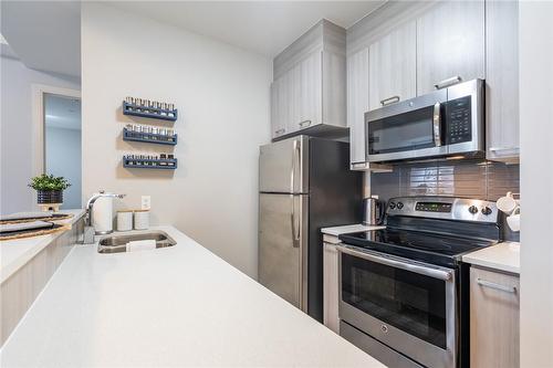 150 Main Street W|Unit #402, Hamilton, ON - Indoor Photo Showing Kitchen With Double Sink