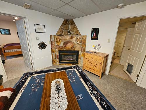 3433 Highway 6, Nelson, BC - Indoor Photo Showing Other Room With Fireplace