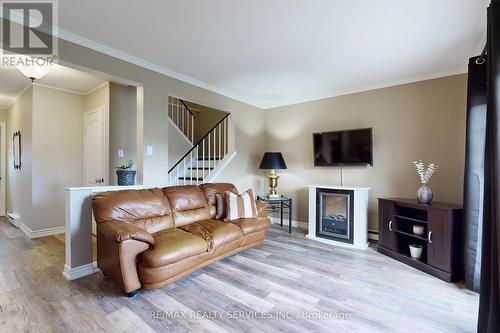 9 Greenhills Sq, Brampton, ON - Indoor Photo Showing Living Room With Fireplace
