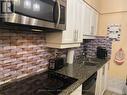 #207 -810 Scollard Crt, Mississauga, ON  - Indoor Photo Showing Kitchen With Double Sink 