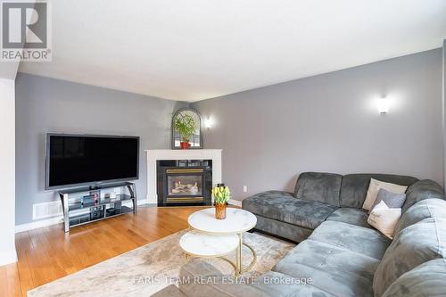 1007 Leslie Drive, Innisfil, ON - Indoor Photo Showing Living Room With Fireplace
