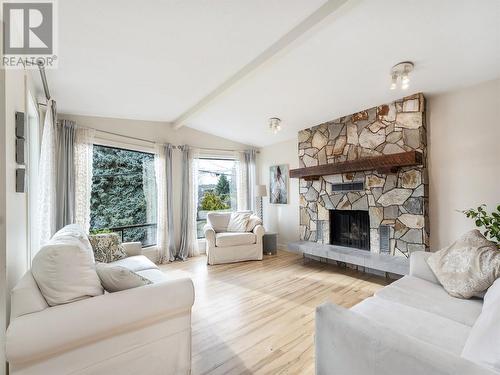 9001 Husband Road, Coldstream, BC - Indoor Photo Showing Living Room With Fireplace