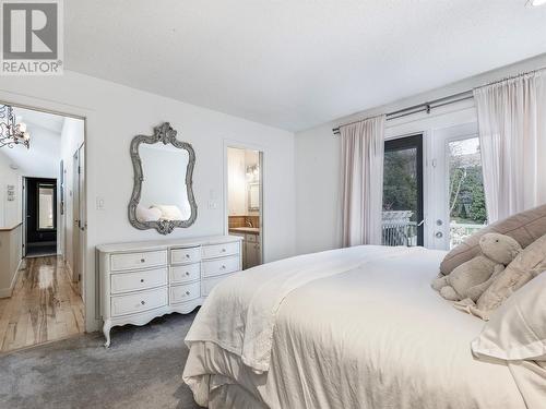 9001 Husband Road, Coldstream, BC - Indoor Photo Showing Bedroom