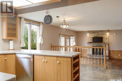 2407 Strathmore Place E, Regina, SK - Indoor Photo Showing Kitchen With Fireplace