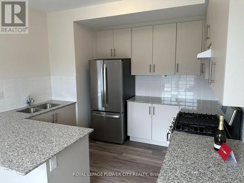 61 - 70 Knotsberry Circle, Brampton, ON - Indoor Photo Showing Kitchen With Double Sink