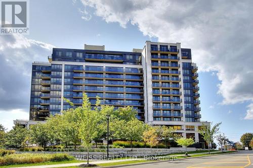 303 - 55 De Boers Drive, Toronto, ON - Outdoor With Balcony With Facade