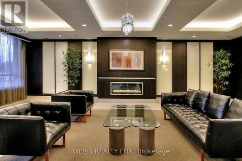 303 - 55 De Boers Drive, Toronto, ON - Indoor With Fireplace