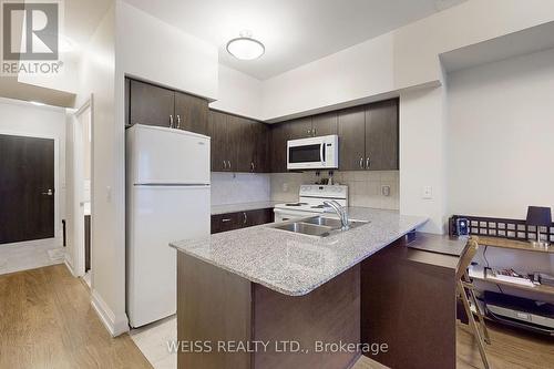 303 - 55 De Boers Drive, Toronto, ON - Indoor Photo Showing Kitchen With Double Sink