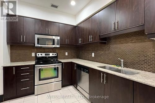 303 - 55 De Boers Drive, Toronto, ON - Indoor Photo Showing Kitchen With Double Sink With Upgraded Kitchen