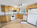 82 Greyowl Drive, Onanole, MB  - Indoor Photo Showing Kitchen With Double Sink 