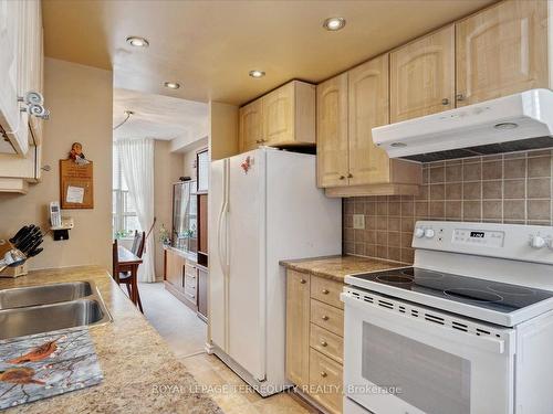 207-100 County Court Blvd, Brampton, ON - Indoor Photo Showing Kitchen With Double Sink