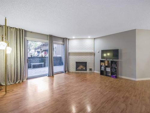 107-983 Bernard Avenue, Kelowna, BC - Indoor Photo Showing Living Room With Fireplace