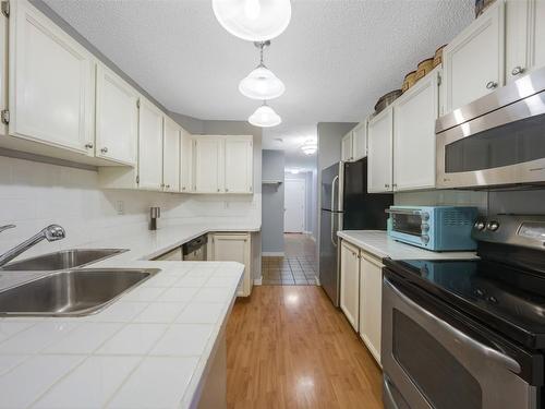 107-983 Bernard Avenue, Kelowna, BC - Indoor Photo Showing Kitchen With Double Sink