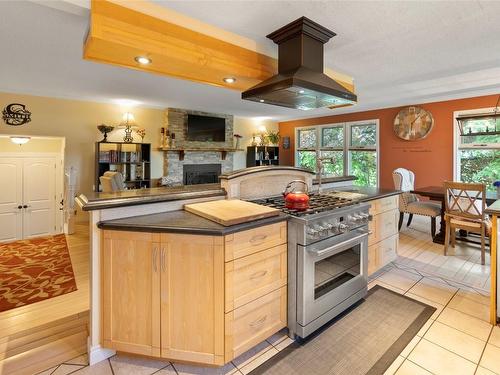 3700 9Th Avenue, Castlegar, BC - Indoor Photo Showing Kitchen With Fireplace