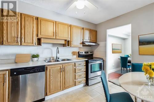 This photo is virtually decluttered and/or staged - 665 Bathgate Drive Unit#1506, Ottawa, ON - Indoor Photo Showing Kitchen With Double Sink