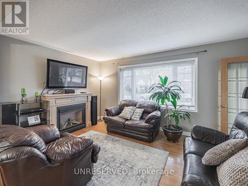 49 Mccaul St, Brampton, ON - Indoor Photo Showing Living Room With Fireplace
