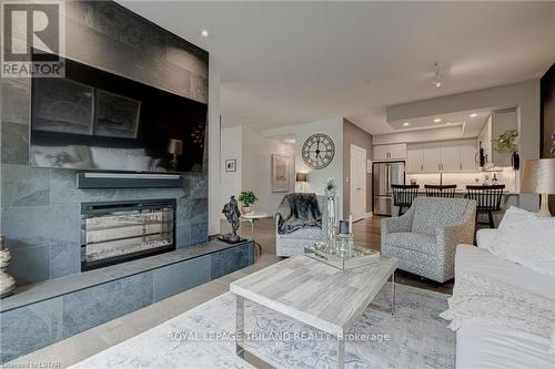 #604 -505 Talbot St, London, ON - Indoor Photo Showing Living Room With Fireplace