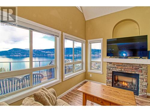 6723 La Palma Loop Unit# 242 Lot# 242, Fintry, BC - Indoor Photo Showing Living Room With Fireplace