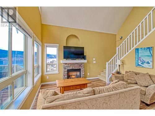 6723 La Palma Loop Unit# 242 Lot# 242, Fintry, BC - Indoor Photo Showing Living Room With Fireplace