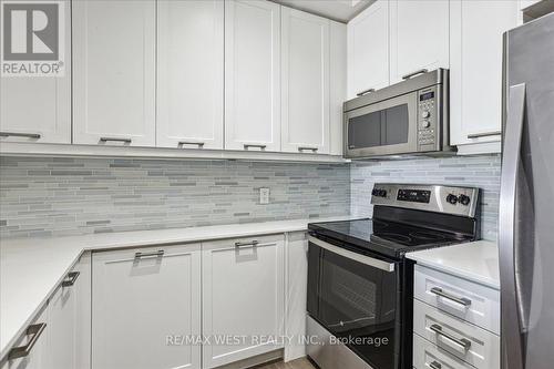 #211 -2480 Prince Michael Dr, Oakville, ON - Indoor Photo Showing Kitchen With Upgraded Kitchen
