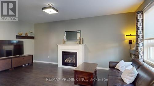 2307 Pilgrim Square, Oshawa, ON - Indoor Photo Showing Living Room With Fireplace
