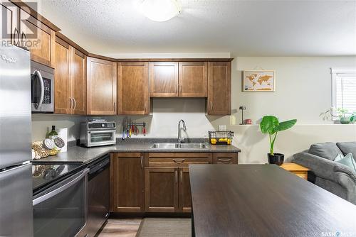 107 Kinsmen Crescent, Martensville, SK - Indoor Photo Showing Kitchen With Double Sink