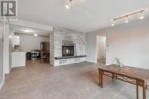 1321 Maccleave Avenue, Penticton, BC - Indoor Photo Showing Living Room With Fireplace
