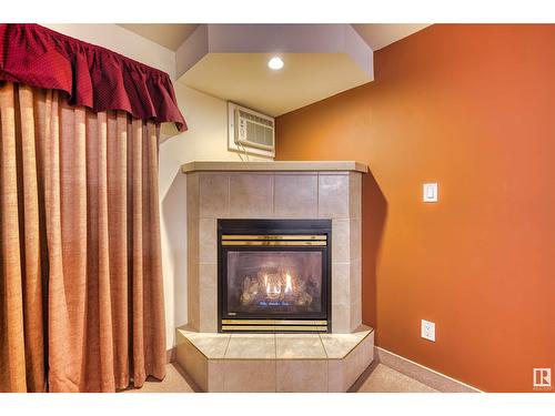 #103 5623 54 St, Cold Lake, AB - Indoor Photo Showing Living Room With Fireplace