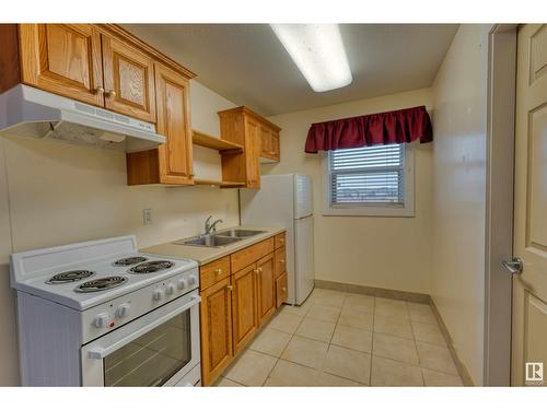#103 5623 54 St, Cold Lake, AB - Indoor Photo Showing Kitchen With Double Sink