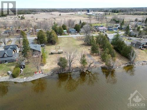 Grab your paddle board or kayak and spend some hours soaking up the sunshine while checking out the lake! - 171 Gardiner Shore Road, Carleton Place, ON - Outdoor With Body Of Water With View