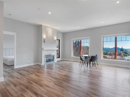 405-1335 Bear Mountain Pkwy, Langford, BC - Indoor Photo Showing Living Room With Fireplace