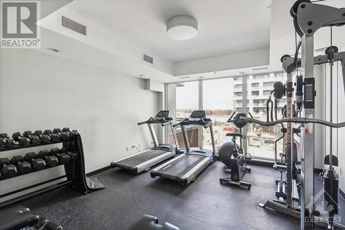 Your condo gym includes sunset views over the Chaudiere Falls - 320 Miwate Private Unit#411, Ottawa, ON - Indoor Photo Showing Gym Room