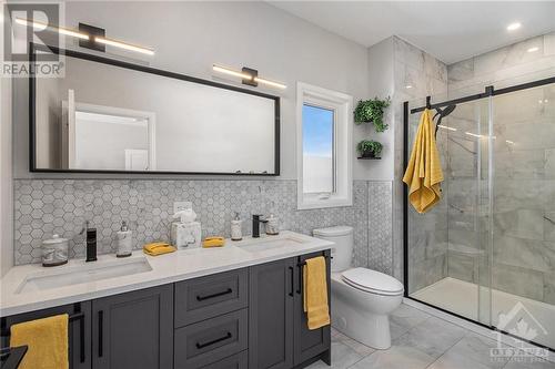 Ensuite with custom backsplash. - 318 Moore Crescent, Kemptville, ON - Indoor Photo Showing Bathroom