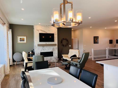 1711 Pine Ridge Mountain Place, Invermere, BC - Indoor Photo Showing Dining Room With Fireplace