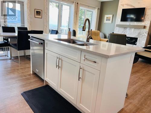 1711 Pine Ridge Mountain Place, Invermere, BC - Indoor Photo Showing Kitchen With Fireplace With Double Sink