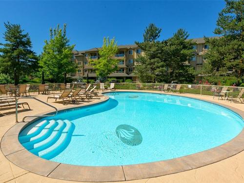 306-1966 Enterprise Way, Kelowna, BC - Outdoor With In Ground Pool With Backyard