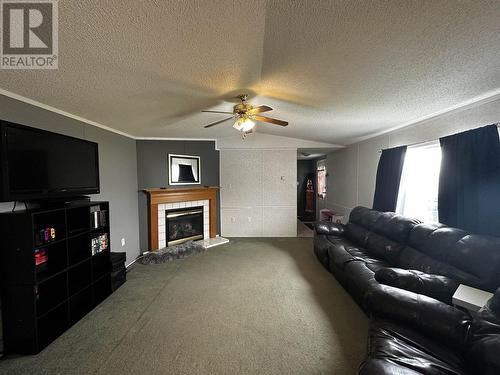 51 5701 Airport Drive, Fort Nelson, BC - Indoor With Fireplace