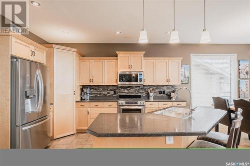 219 Fawcett Crescent, Saskatoon, SK - Indoor Photo Showing Kitchen With Stainless Steel Kitchen With Double Sink