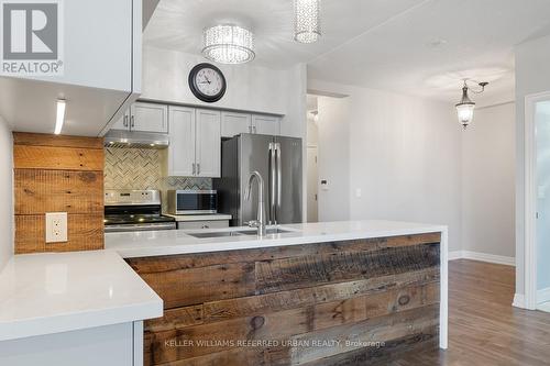#409 -2121 Lake Shore Blvd W, Toronto, ON - Indoor Photo Showing Kitchen With Stainless Steel Kitchen With Double Sink