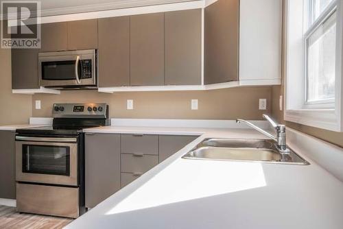 105 Cross Road Unit#F, Bay Roberts, NL - Indoor Photo Showing Kitchen With Stainless Steel Kitchen With Double Sink