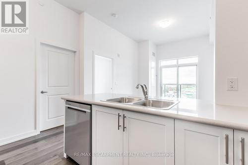 617 - 5055 Greenlane Road, Lincoln, ON - Indoor Photo Showing Kitchen With Double Sink