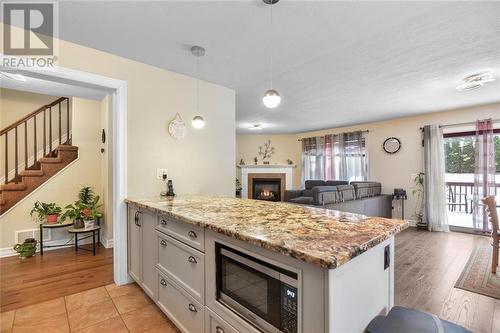 1039 Fitzsimmons Drive, Brockville, ON - Indoor Photo Showing Kitchen With Fireplace