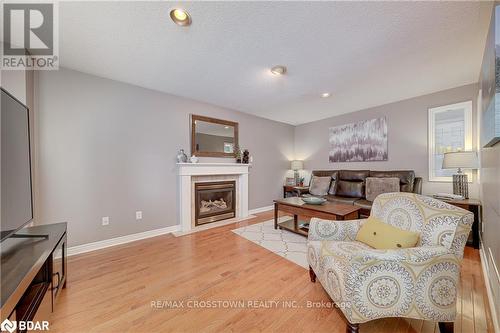 19 Allsop Cres, Barrie, ON - Indoor Photo Showing Living Room With Fireplace