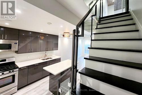 #106 -1 Shaw St, Toronto, ON - Indoor Photo Showing Kitchen With Double Sink